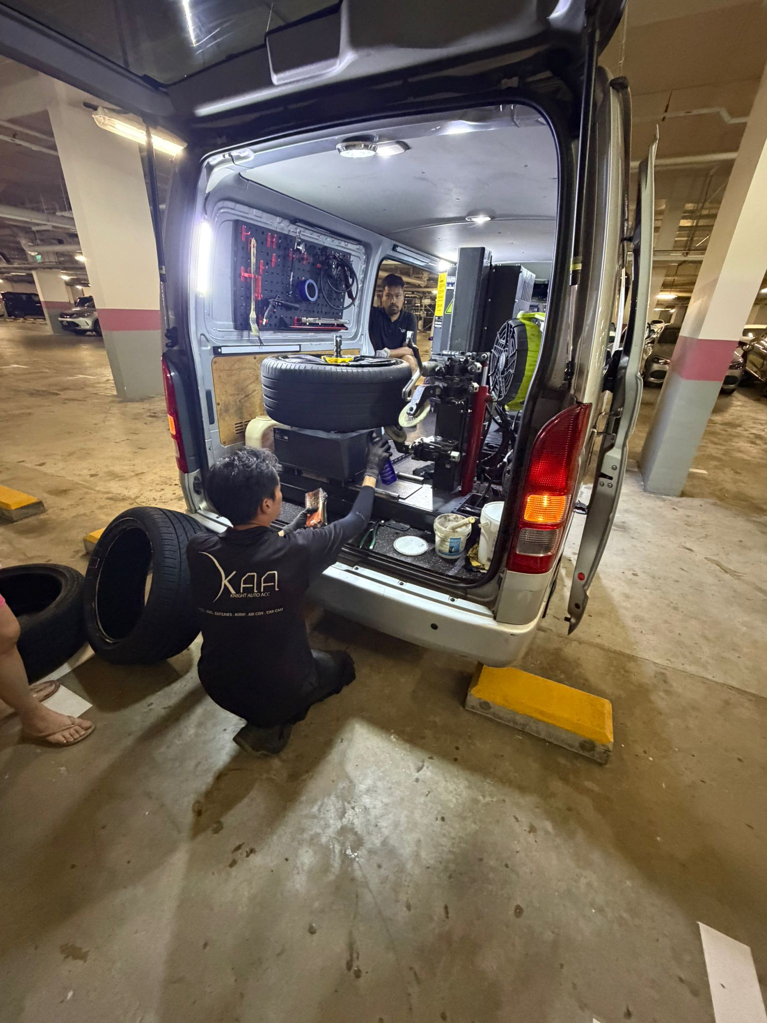 KAA team performing mobile tyre replacement at a condominium carpark in Singapore